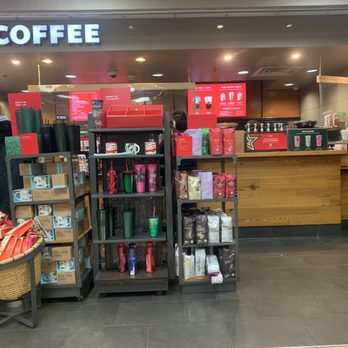 Starbucks - a woman standing in front of a coffee shop - Coffee & Tea Near Me - Penns Grove, New Jersey