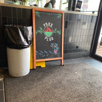Poke Plus & Teriyaki - a chalkboard sign and trash can - Hawaiian Near Me - Madison, Wisconsin