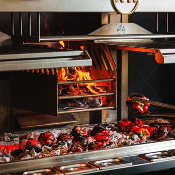 Aiona - Mibrasa wood fire stove at the center of our exhibition kitchen - Mediterranean Near Me - Sacramento, California Aiona - Mibrasa wood fire stove at the center of our exhibition kitchen - Mediterranean Near Me - Sacramento, California