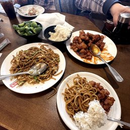 Orange chicken and pork chow mien. Yummy cucumbers . Orange chicken and pork chow mien. Yummy cucumbers .