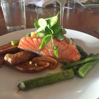 Ray's Boathouse - Grilled Wild King Salmon with asparagus, green peas and roasted fingerling potatoes, chopped egg, beurre blanc, truffle salt - New American Near Me - Seattle, Washington Ray's Boathouse - Grilled Wild King Salmon with asparagus, green peas and roasted fingerling potatoes, chopped egg, beurre blanc, truffle salt - New American Near Me - Seattle, Washington