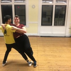 Salsa Matei Dance School - SMDC Instructors, Bryn and Ricardo practicing tricks before class