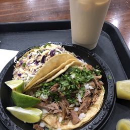 Fish taco, carnitas taco and a horchata