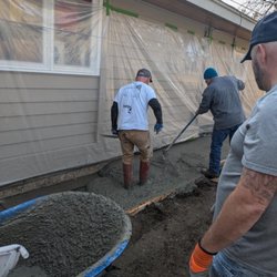 Structural Concepts - Placing concrete getting ready to finish