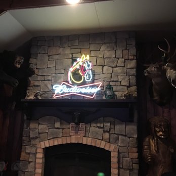 Stockmans Bar - a neon sign above a fireplace - Sports Bars Near Me - Layton, Utah