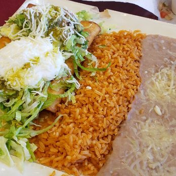 Taqueria La Barca - Flautas dressed with sour cream, guacamole, lettuce, cheese, and a side of rice and beans - Mexican Near Me - Arcata, California Taqueria La Barca - Flautas dressed with sour cream, guacamole, lettuce, cheese, and a side of rice and beans - Mexican Near Me - Arcata, California