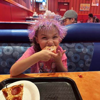 John's Incredible Pizza - Riverside - Birthday Girl enjoying her pizza - Arcades Near Me - Riverside, California