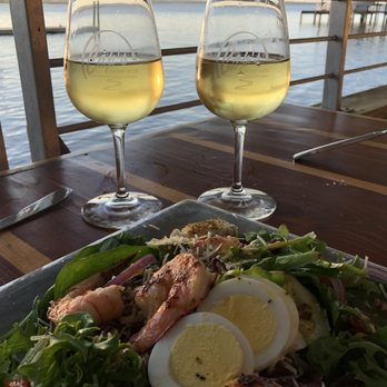Caps On The Water - A glass of Riesling and a luscious salad with locally caught grilled shrimp. - Seafood Near Me - St Augustine, Florida Caps On The Water - A glass of Riesling and a luscious salad with locally caught grilled shrimp. - Seafood Near Me - St Augustine, Florida