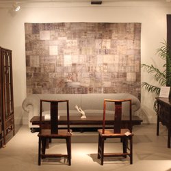 Turkish carpet offers lovely backdrop to this setting...with a British sofa and Chinese bench/coffee table, antique chairs & display cabinet