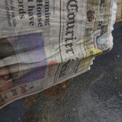 Courier-Journal Newspaper - Paper is so drenched I could barely get it open