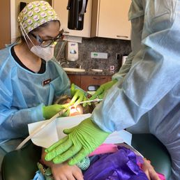 Dr. Suzy is carefully caring for a cavity for youngest daughter who is 5.