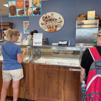 Kilwins - a woman ordering a dessert - Candy Stores Near Me - Boyne City, Michigan Kilwins - a woman ordering a dessert - Candy Stores Near Me - Boyne City, Michigan