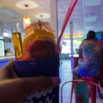 Nolasips - a person holding a cup with a drink in it - Shaved Ice Near Me - New Orleans, Louisiana