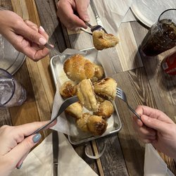 Gaetano's Pizzeria - Garlic rolls with friends