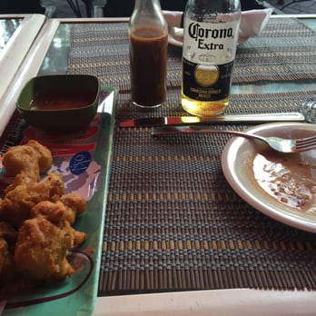Bamboo Fire Cafe - Conch Fritters outside. The great fritters and a tasty cold beverage! - Caribbean Near Me - Delray Beach, Florida