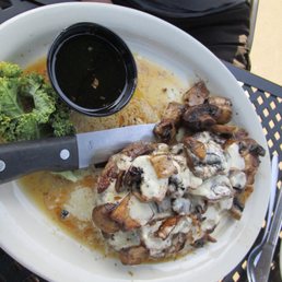 a plate of food with broccoli and sauce