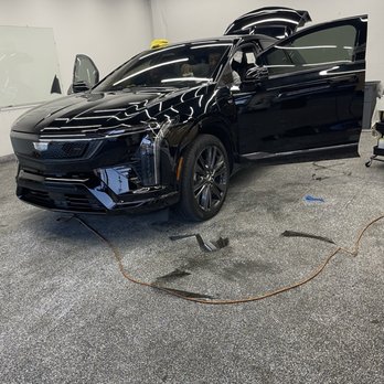 Olympic Tint - Finalizing tint. Did driver and passenger windows and front windshield - Car Window Tinting Near Me - Los Angeles, California