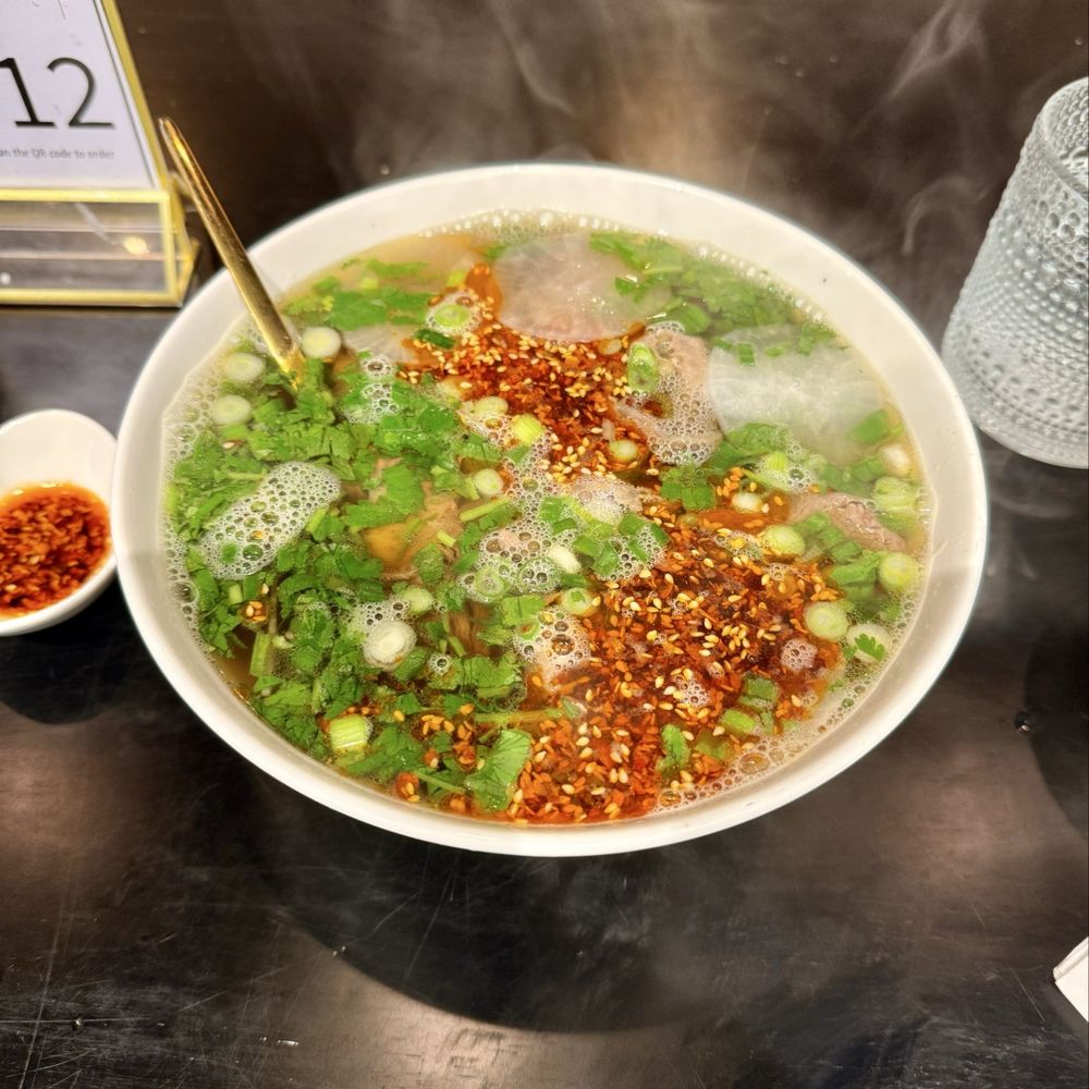 Kusan Bazaar | Silk Road Grill & Noodles 龟兹集市 - Beef noodles soup with a side of extra chili sauce - Halal Near Me - Mountain View, California Kusan Bazaar | Silk Road Grill & Noodles 龟兹集市 - Beef noodles soup with a side of extra chili sauce - Halal Near Me - Mountain View, California