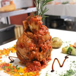Canal Side Inn - Pork Osso Bucco
Slow-roasted pork with plum tomato ragu, fennel and Bermuda onion with truffle herb roasted potatoes & sautée...