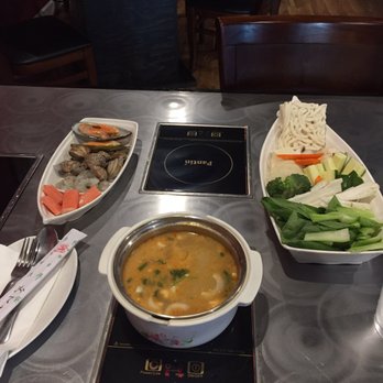 Yang's Shabu Shabu - Seafood combination hot pot with spicy coconut broth. - Chinese Near Me - Evansville, Indiana Yang's Shabu Shabu - Seafood combination hot pot with spicy coconut broth. - Chinese Near Me - Evansville, Indiana