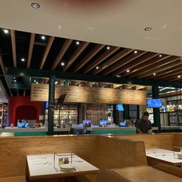 View of bar, tables looking out toward front entrance