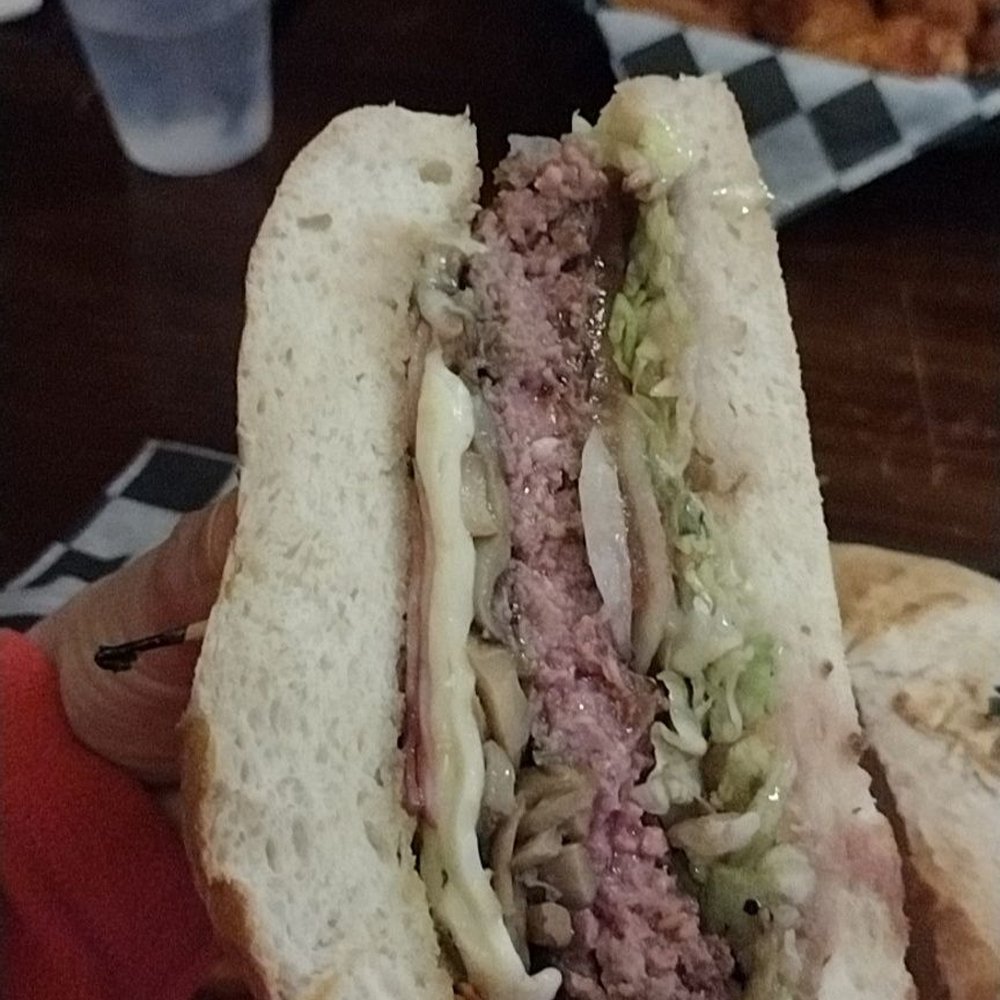 JP Dwyers Pub - Cross section of burger. - New American Near Me - North Tonawanda, New York JP Dwyers Pub - Cross section of burger. - New American Near Me - North Tonawanda, New York