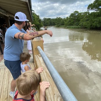 Pine Tree Lodge - Outside bar overlooking the bayou as a airboat goes by - Seafood Near Me - Beaumont, Texas