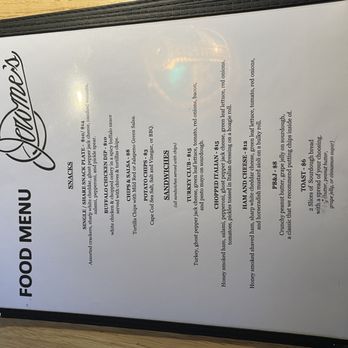Jerome's - A printed menu listing food and snack items, including sandwiches, chips, and appetizers, with prices and descriptions. - Sports Bars Near Me - Portland, Maine