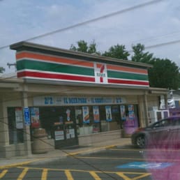 a pink teddy bear in front of a store a pink teddy bear in front of a store