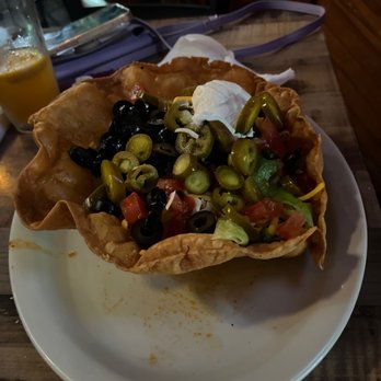 Bourbon on Main - Leslie's Taco salad. Loaded with delicious black olives. - Bars Near Me - New Port Richey, Florida Bourbon on Main - Leslie's Taco salad. Loaded with delicious black olives. - Bars Near Me - New Port Richey, Florida