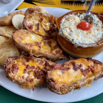 The Mountain Bar & Grill - Appetizer mix plate. 4 Potato Skins Artichoke Dip Nan 4 Lobster & Crab Won Tons 4 Mac & cheese bites - Pubs Near Me - Black River, Michigan The Mountain Bar & Grill - Appetizer mix plate. 4 Potato Skins Artichoke Dip Nan 4 Lobster & Crab Won Tons 4 Mac & cheese bites - Pubs Near Me - Black River, Michigan