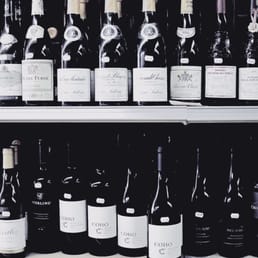 rows of wine bottles rows of wine bottles