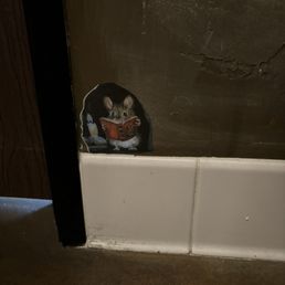 Little mouse reading his book in the ladies room. I couldn't resist taking this picture. Little mouse reading his book in the ladies room. I couldn't resist taking this picture.