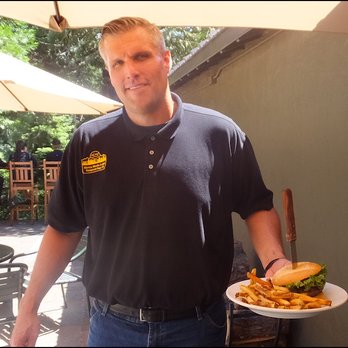 The Rustic Table - Meet Chris, my super-friendly server, as he brings my "The Rustic Burger" to me with a smile. - New American Near Me - Emigrant Gap, California