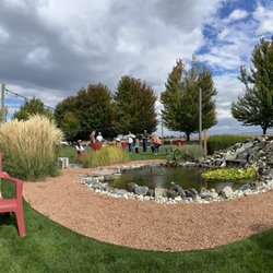 Castillo de Feliciana Vineyard & Winery - Outdoor seating by the pond.