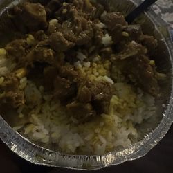 Tasteless curry goat and mush rice