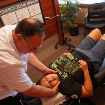 Warwick Chiropractic & Massage - Dr Warwick adjusting patient. - Chiropractors Near Me - Lacey, Washington Warwick Chiropractic & Massage - Dr Warwick adjusting patient. - Chiropractors Near Me - Lacey, Washington