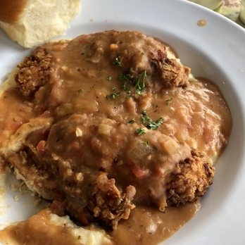 Rooster's Restaurant - Tomato Gravy Chicken over Grits - American Near Me - Jackson, Mississippi Rooster's Restaurant - Tomato Gravy Chicken over Grits - American Near Me - Jackson, Mississippi