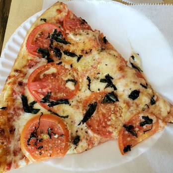 Planet Pizza - a slice of pizza on a paper plate - Pizza Near Me - Danbury, Connecticut Planet Pizza - a slice of pizza on a paper plate - Pizza Near Me - Danbury, Connecticut