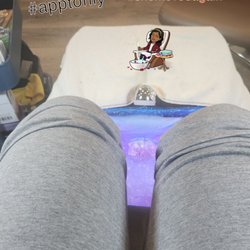 My feet actually soaking in a working spa chair in a very nice shop.