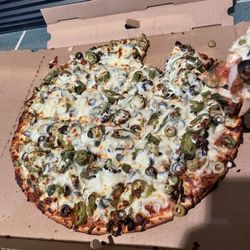 Red's Savoy Pizza - The fresh pizza with one piece removed!