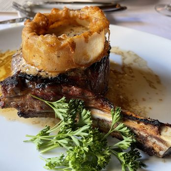 Chicago Chop House - Cowgirl Dry-Aged Ribeye Presentation. - Steakhouses Near Me - Chicago, Illinois