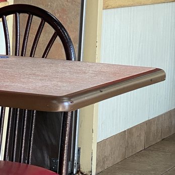 Wienerschnitzel - 3 flies on edge of the table. - Hot Dogs Near Me - Odessa, Texas