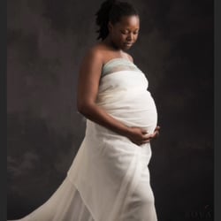 Kim Bova Photography - Kim is so creative with maternity photography. She draped material around her beautiful subject!!  Photo by kimbovaphotography.com