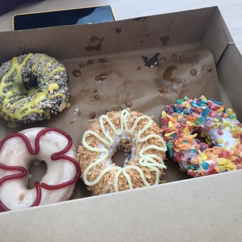 Shaka Donuts - B-A-N-A-N-A-S. (Top left) Big Island (bottoms left) Coco-nuts and Wipe Out (bottom right) - Donuts Near Me - Orlando, Florida Shaka Donuts - B-A-N-A-N-A-S. (Top left) Big Island (bottoms left) Coco-nuts and Wipe Out (bottom right) - Donuts Near Me - Orlando, Florida