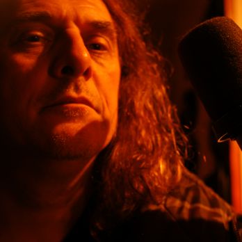 Amusikzone - a man in a recording studio - Recording & Rehearsal Studios Near Me - Toronto, Ontario