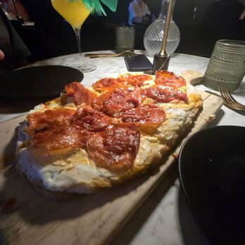The Goose - Hot honey pepperoni pizza and nothing but feathers cocktail - Cocktail Bars Near Me - Scottsdale, Arizona