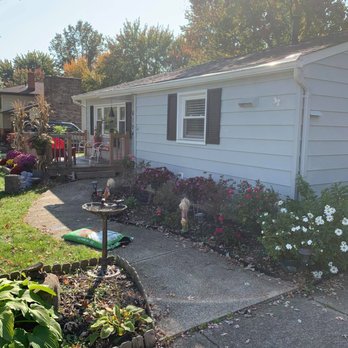 Get Your Coat - exterior white paint job with black trim front of house - Painters Near Me Get Your Coat - exterior white paint job with black trim front of house - Painters Near Me
