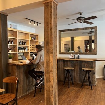 Treehouse Coffee - a man sitting at a bar - Cafes Near Me - Duck, North Carolina Treehouse Coffee - a man sitting at a bar - Cafes Near Me - Duck, North Carolina