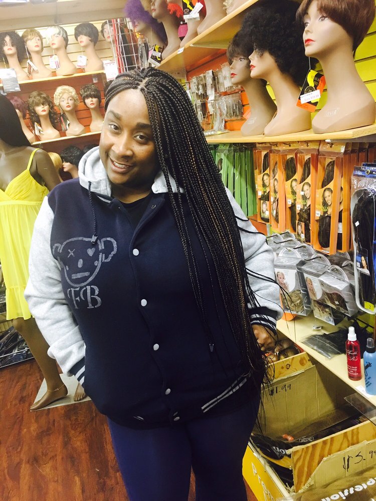 Touba Hair Braiding & Beauty Supply Logo